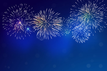 Brightly Colorful Fireworks and blue smoke from firework on twilight background