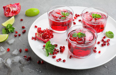  pomegranate juice in glass cups on white plate