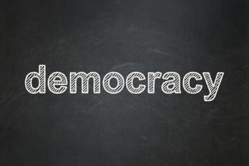 Obraz premium Politics concept: text Democracy on Black chalkboard background