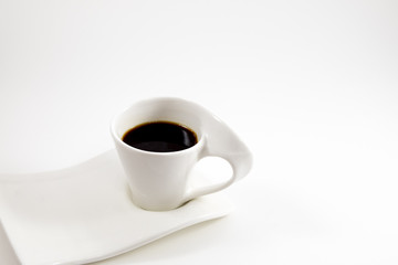 white background coffee cup with coffee placed on dish. image for copy space, food, drink, isolated, beverage, business concept