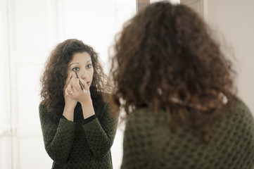 woman in front of a mirror