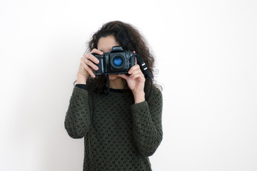 Young latin woman with a camera