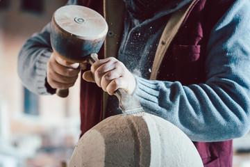Close-up on chisel of stonemason working