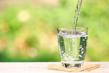 Closeup Glass of water on table nature background