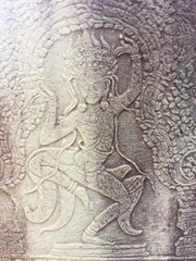 Apsara dancers carved on the wall of Khmer ancient temple.  Angkor Wat in Siem Reap, Cambodia. 