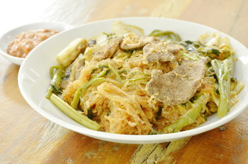 fried glass noodles with pork and vegetable on plate dipping sukiyaki sauce