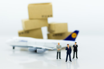 Miniature business people : businesses team with plane. Image use for background travel, business trip travel advisory agency of transportation concept.