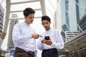 Two Handsome Myanmar businessmen in modern town