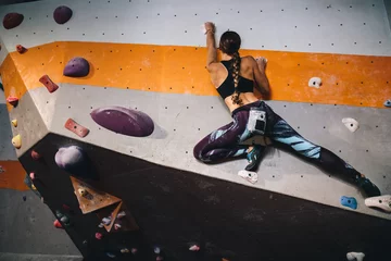 Foto op Aluminium Woman climbing indoor boulder wall © Jacob Lund