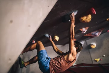 Foto auf Alu-Dibond Man climbing indoor boulder wall © Jacob Lund