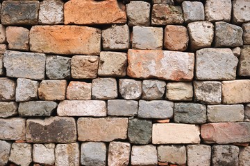 Rows of weathered stone blocks and bricks