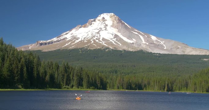 Kayaking on Trillium Lake, Oregon, with Snowcapped Mountain in Background
