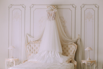 Fototapeta na wymiar bridal wedding dress in a luxury bedroom