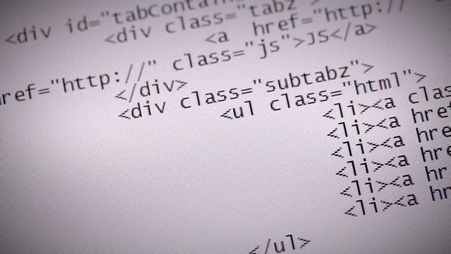 Website development. Closeup of HTML, CSS, JavaScript and PHP code scrolling over white background on computer screen