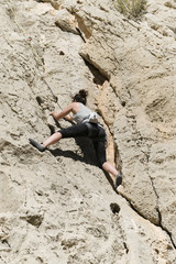 young woman climbing