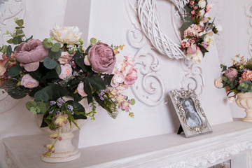 Pink flowers in white vase. Interior