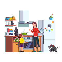 Mother feeding son at home kitchen