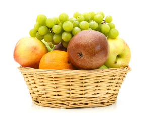 Fresh organic fruits  in  wicker basket on white background