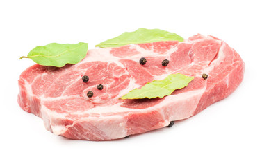 Raw pork neck meat cut with black pepper and three bay leaves isolated on white background fresh one slice without bone .