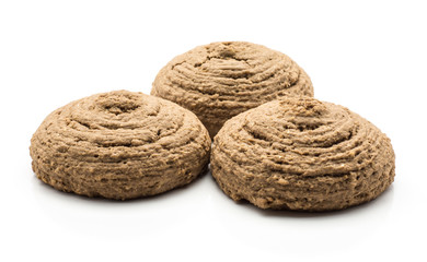 Three cocoa oat cookies isolated on white background brown crispy round shape.