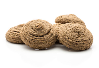 Cocoa oat cookies isolated on white background brown crispy drop shape biscuits.