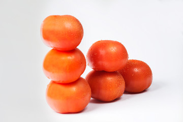 Tomatoes on a white background, different compositions.