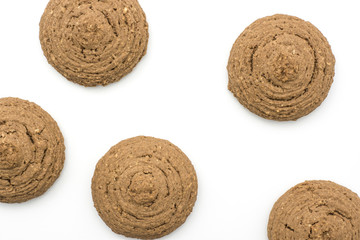Five oat cookies brown round crispy isolated on white background top view.