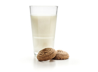 Two cocoa oat cookies with a glass of milk isolated on white background drop shape brown crispy biscuits.