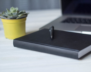 laptop and documents in the workplace.