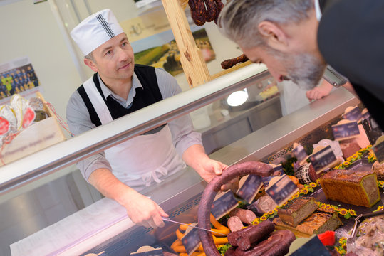 butcher serving a customer