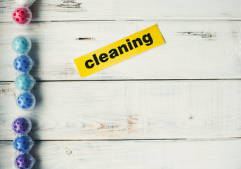 Cleaning house or office concept. Toilet refreshing block, Cleaning inscription on a white wooden...