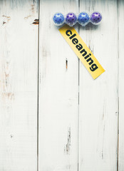 Cleaning house or office concept. Toilet refreshing block, Cleaning inscription on a white wooden background. Top view, closeup