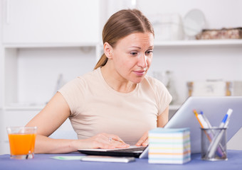 Frustrated woman with notebook