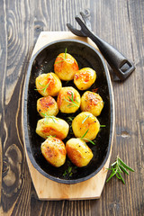 Baked potatoes with rosemary.