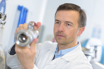 pharmacological engineer holding a device