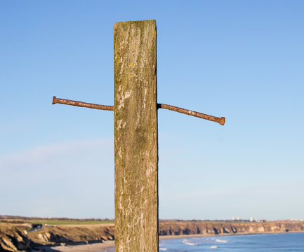 wood cross with nails