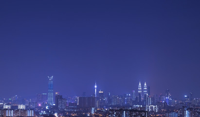 Fototapeta na wymiar Kuala Lumpur city skyline during blue hour.Amazing view of urban city at night.