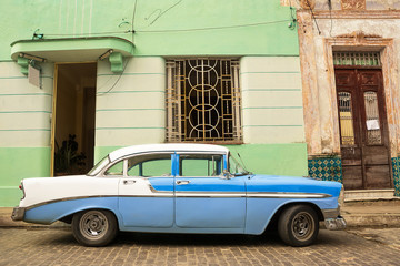 Old American car parked on the cuban street