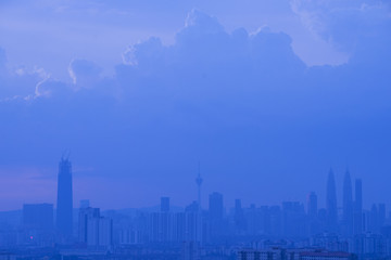 Fototapeta na wymiar Kuala Lumpur city skyline during dusty morning with thick fog.