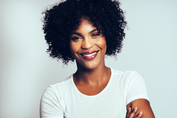 Profile of an attractive African woman against a gray background