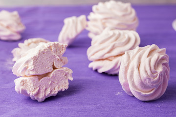 Homemade marshmallow on a purple background. Toned.