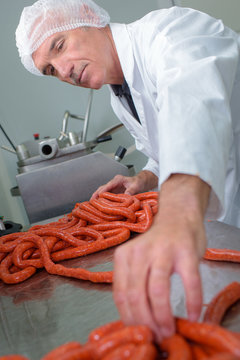 worker making sausages