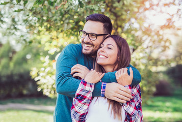 Fototapeta premium Happy couple in love having fun outdoors and smiling.