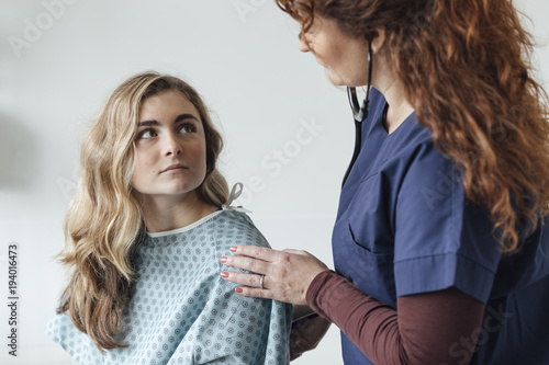 Doctor Examining Patient With Stethoscope Stock Photo And Royalty
