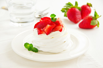 meringue nests with strawberry cream and fresh strawberries