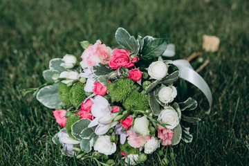 beautiful wedding bouquet of roses on the grass