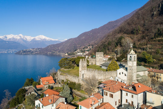 Castle of Corenno Plinio on Como lake in Italy. Little village. Aerial view from a drone