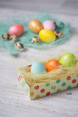 Fototapeta na wymiar Painted Easter eggs on old boards