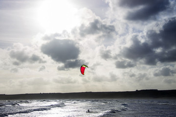Kitesurfing in the sea. Cruden Bay, Scotland, United Kingdom. February 2018