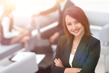 successful young business woman on blurred background office